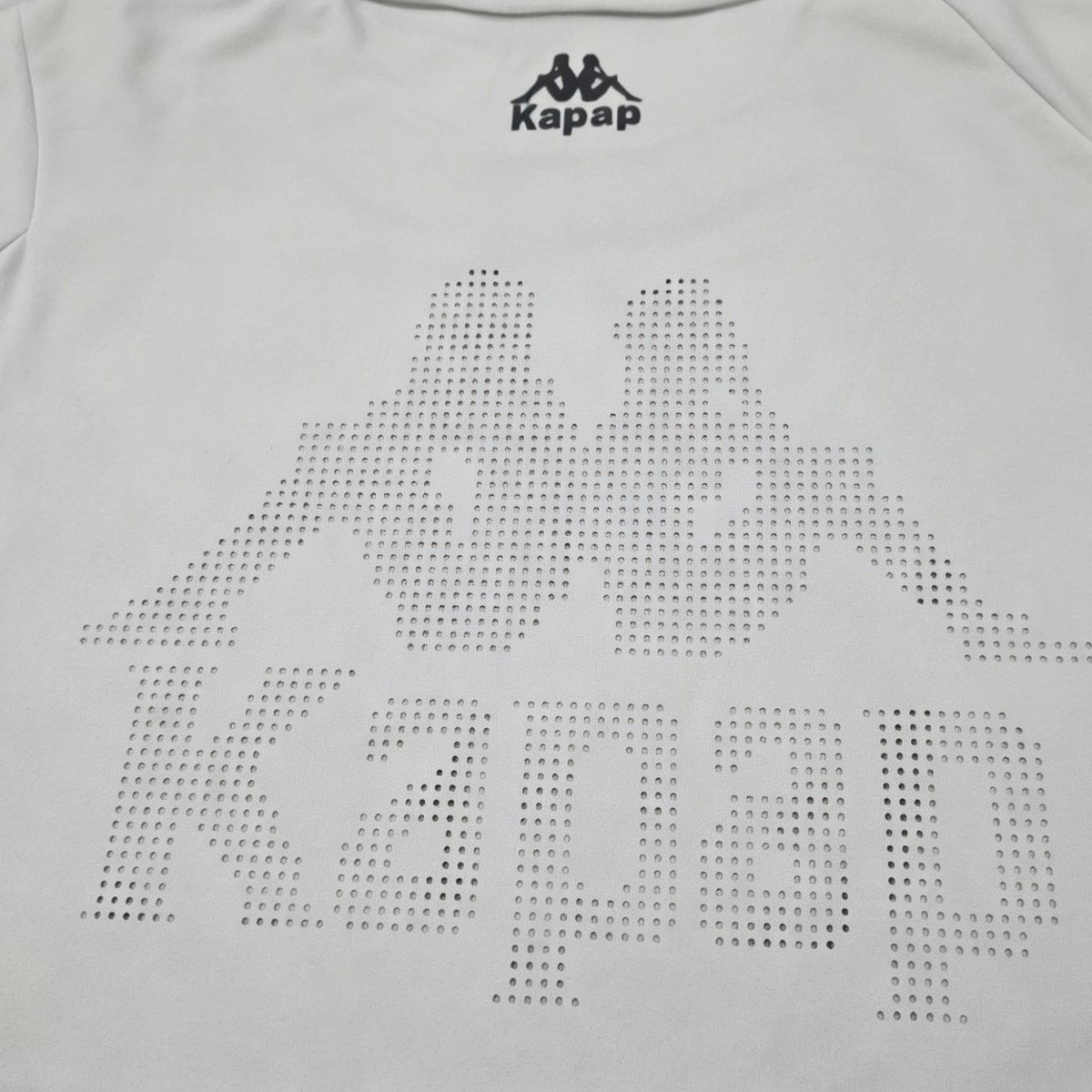 Perforated logo artwork sample on white quick-dry fabric