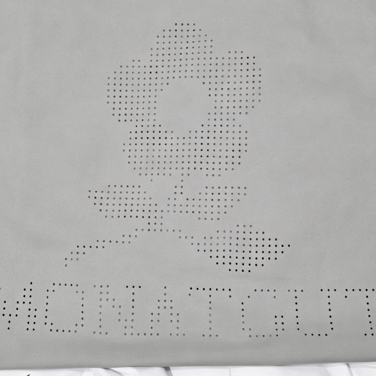 Perforated custom lettering sample on white quick-dry fabric